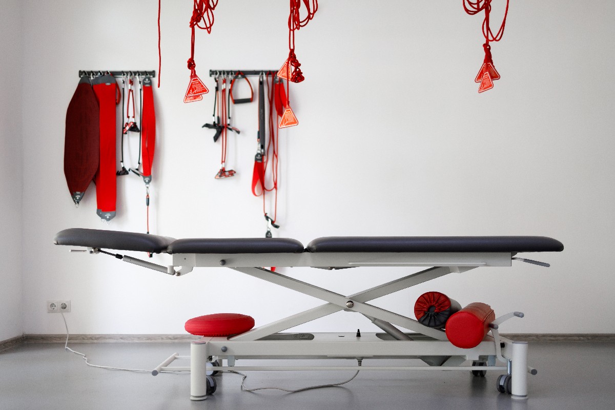 Physiotherapist's Office With Suspension Therapy System Red Cord For Treatment And Rehabilitation